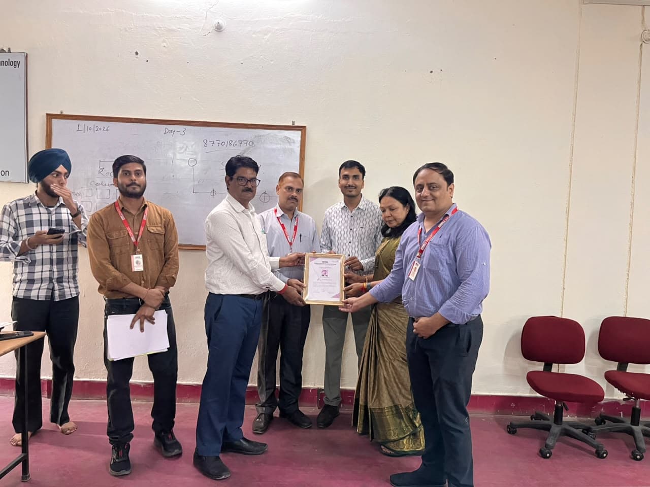 The team at a certificate presentation during a previous SAN workshop